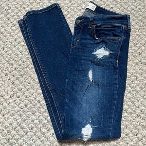 Dark wash distressed Hollister skinny jeans. 7R. Hard denim. Like new!